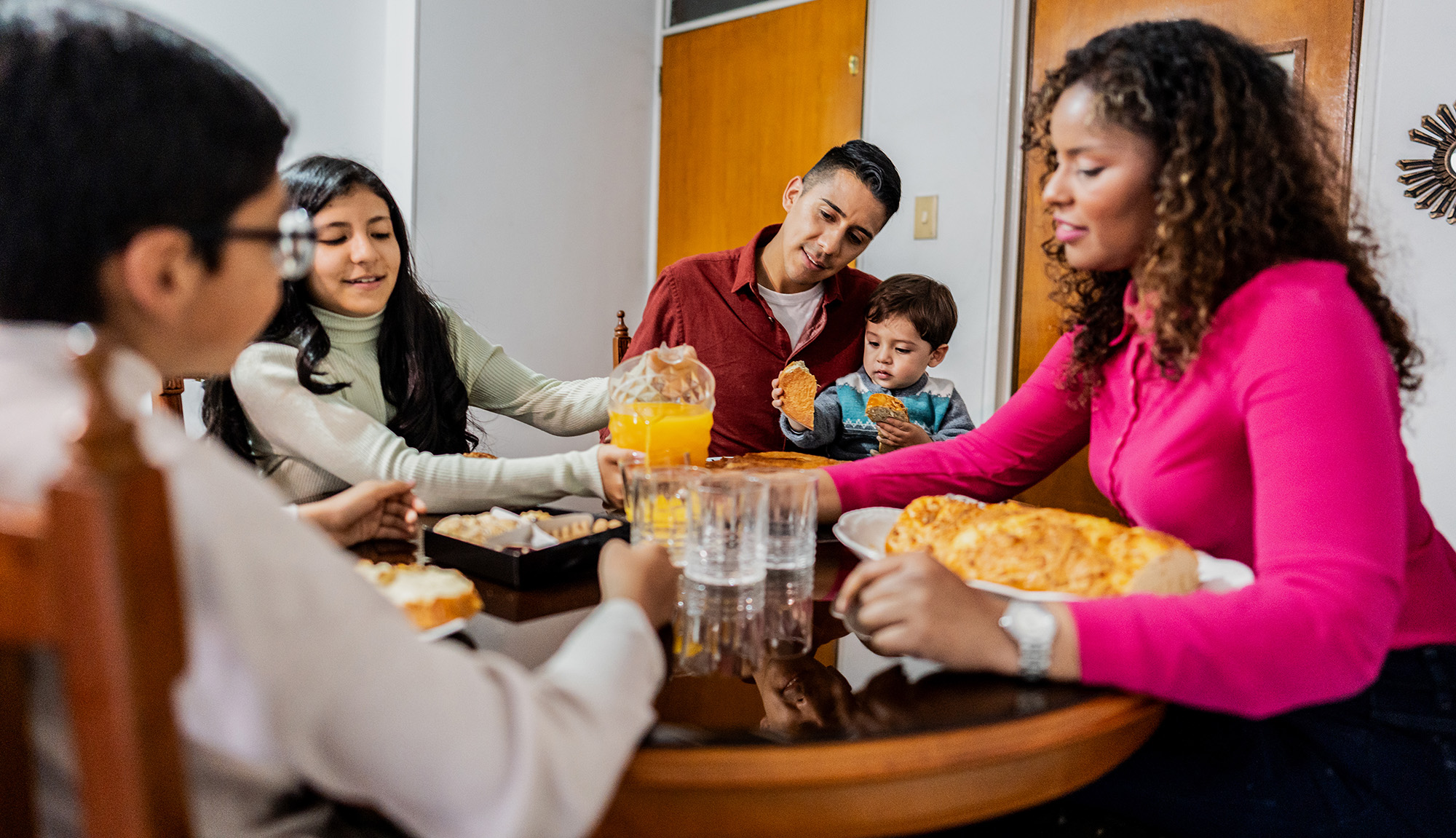 Family having breakfast together at home